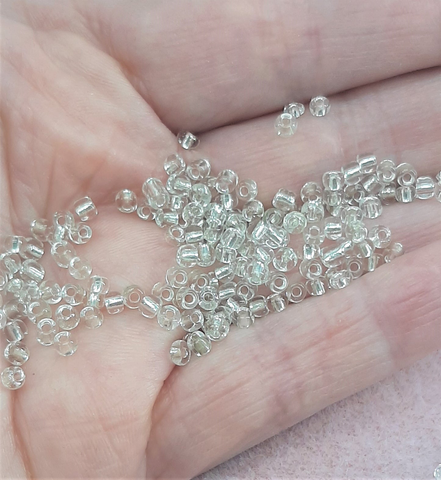 CLEAR GLASS/SILVER LINED SEED BEADS