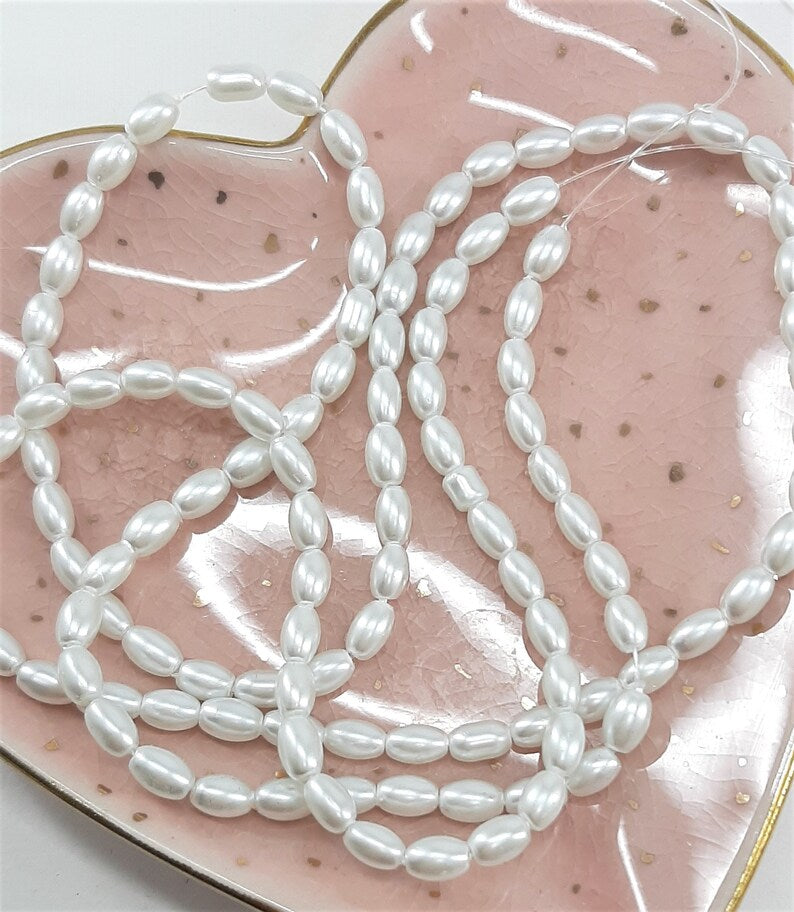 STRAND OF GLASS RICE PEARLS
