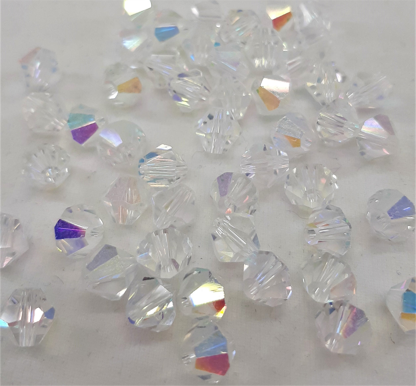 TUBE GLASS BICONE BEADS
