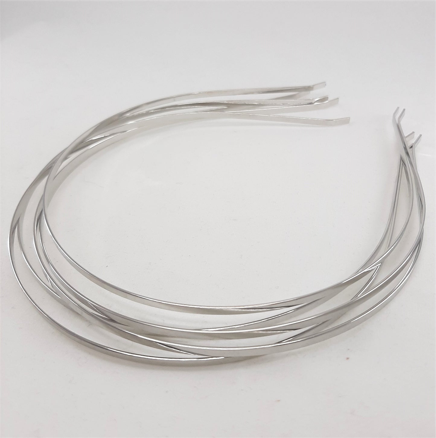 SILVER TONE TIARA HEADBANDS
