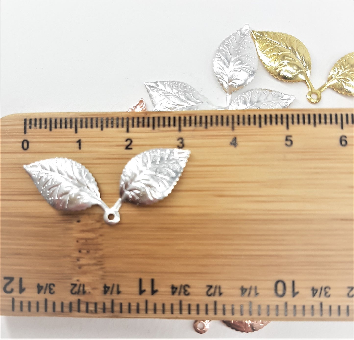 DOUBLE LEAF CHARMS